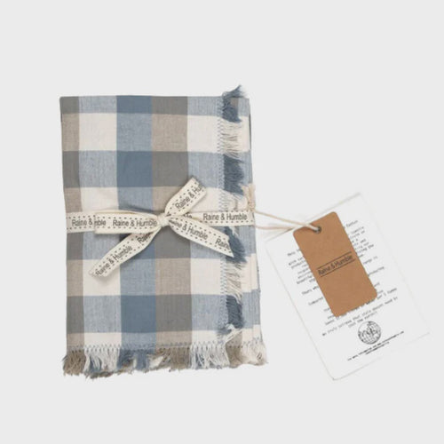 Double Check Napkin S/4 Blue Haze Introducing the Raine & Humble Double Weave Napkin Where elegance meets eco-friendliness. These exquisite napkins are meticulously crafted from recycled fabric, featuring a tastefully woven check pattern in refreshing colors.