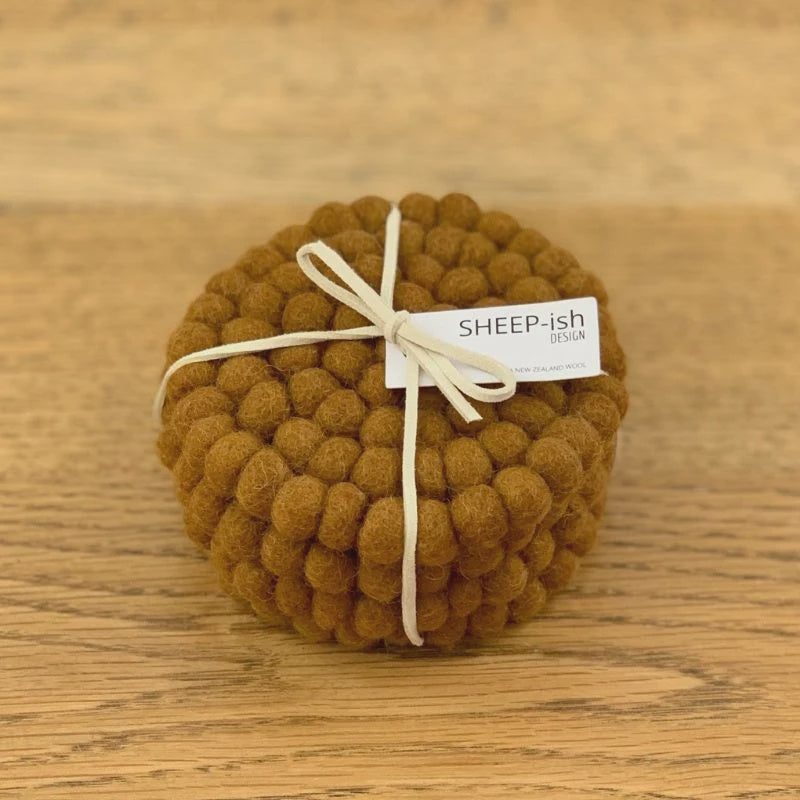 Felt Ball Set of 4 coasters. Handmade in Nepal using 100% NZ wool and non-toxic dyes.