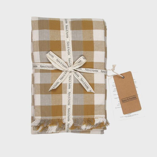 Double Check Tablecloth Yellow Sunset 140x240cm Elevate your dining ambiance with the exquisite Raine & Humble Double Weave Tablecloth. Meticulously crafted from eco-conscious recycled fabric, this tablecloth features a tastefully woven check pattern.