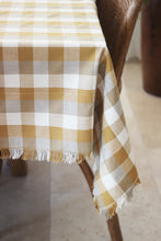Double Check Tablecloth Yellow Sunset 140x240cm Elevate your dining ambiance with the exquisite Raine & Humble Double Weave Tablecloth. Meticulously crafted from eco-conscious recycled fabric, this tablecloth features a tastefully woven check pattern.