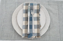 Double Check Napkin S/4 Blue Haze Introducing the Raine & Humble Double Weave Napkin Where elegance meets eco-friendliness. These exquisite napkins are meticulously crafted from recycled fabric, featuring a tastefully woven check pattern in refreshing colors.