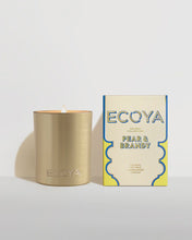 Holiday: Pear & Brandy Goldie Candle By Ecoya The fragrance equivalent of a velvet-clad holiday soirée - classy with a touch of spice. Green pear, brandy, and lime with rose and jasmine, while cedar and musk add the spicy twist