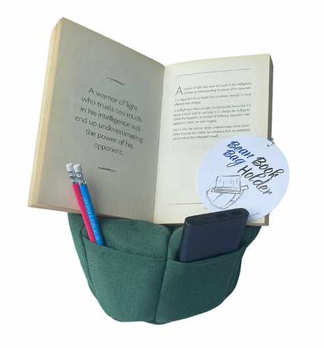 Bean Bag Book Holder This is a great little idea where you can prop your book / ipad / tablet / phone on a soft bean bag to rest your hands. With a pocket for bookmarks, pens or phone, you've got your set up sorted. Available in 3 different colours, Green, Blue and Red. Rosies Gifts & Homeware, Mosgiel, Dunedin.