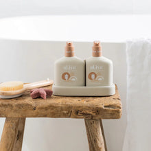 The al.ive baby Hair & Body Duo in Calming Oatmeal contains a Baby Hair & Body Wash & Body Lotion, both housed in a non-slip tray with easy-to-pump lids.