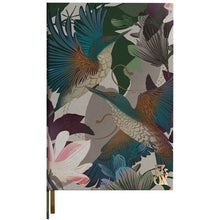 Notebook with a colorful bird and floral design on the cover