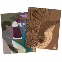 Two notebooks with artistic covers, one with a bird design and the other with abstract art.