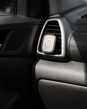 Car interior air vent with black and silver design