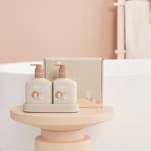 The al.ive baby Hair & Body Duo in Calming Oatmeal contains a Baby Hair & Body Wash & Body Lotion, both housed in a non-slip tray with easy-to-pump lids.