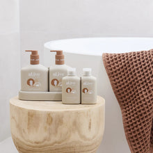 The al.ive baby Hair & Body Duo in Calming Oatmeal contains a Baby Hair & Body Wash & Body Lotion, both housed in a non-slip tray with easy-to-pump lids.