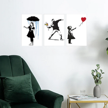 Framed Art Print Canvas Banksy Flower Thrower 30x45cm, Rosies Gifts, Mosgiel, Dunedin for wall art canvas and glass options.Print of Banksy Girl with Balloon. Mounted inside a white floating MDF frame this represents excellent value for money. Rosies Gifts, Mosgiel, Dunedin for wall art canvas and glass options.