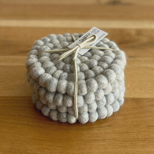 Felt Ball Set of 4 coasters. Handmade in Nepal using 100% NZ wool and non-toxic dyes. 