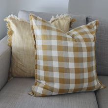 Double Check Cushion Yellow Sunset 50x50cm Upgrade your home's style and comfort with the Raine & Humble Double Weave Cushion. Thoughtfully crafted from eco-conscious recycled fabric, showcasing a tasteful woven check pattern in elegant taupe, crisp ivory, and the warm hues of Yellow Sunset.