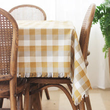 Double Check Tablecloth Yellow Sunset 140x240cm Elevate your dining ambiance with the exquisite Raine & Humble Double Weave Tablecloth. Meticulously crafted from eco-conscious recycled fabric, this tablecloth features a tastefully woven check pattern. 