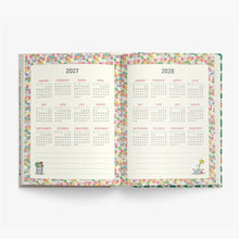 An open planner or calendar showing the years 2027 and 2028 with monthly grids, decorated with a colorful pastel floral border on a white background.