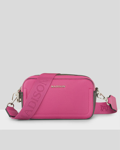 MADDIE DOUBLE ZIP CAMERA CROSSBODY BAG + MONOGRAM BAG STRAP Madison Accessories If you love pink bags, the Maddie camera bag is for you! The perfect mix of hot pink, black and white, this refreshing colour mix makes a statement. Rosies Gifts, Mosgiel, Dunedin.